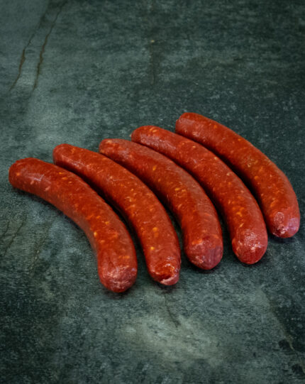 Merguez aus eigener Herstellung, heiß und würzig gegrillt über offener Glut